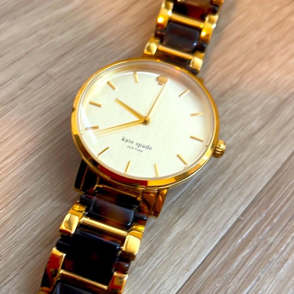 Kate spade watch - tortoise shell & gold. Tiny scratch shown in video.